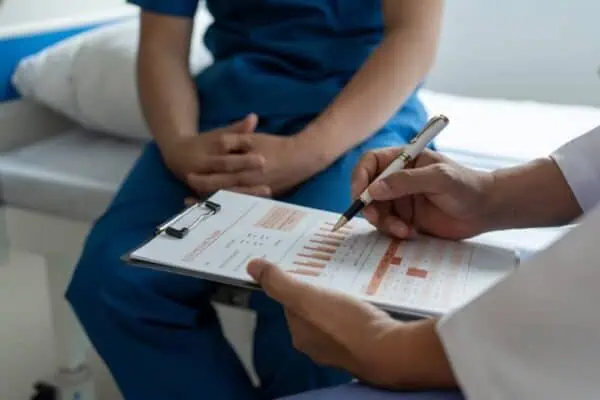 A doctor going over test results with a patient.