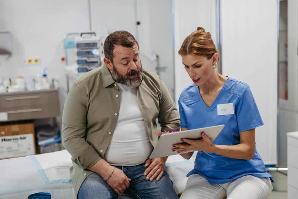 A doctor discussing medical test results with a middle-aged patient.