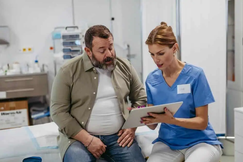 A doctor discussing medical test results with a middle-aged patient.