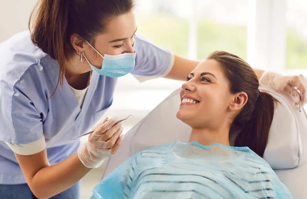 A dentist conducting a dental checkup on a patient.