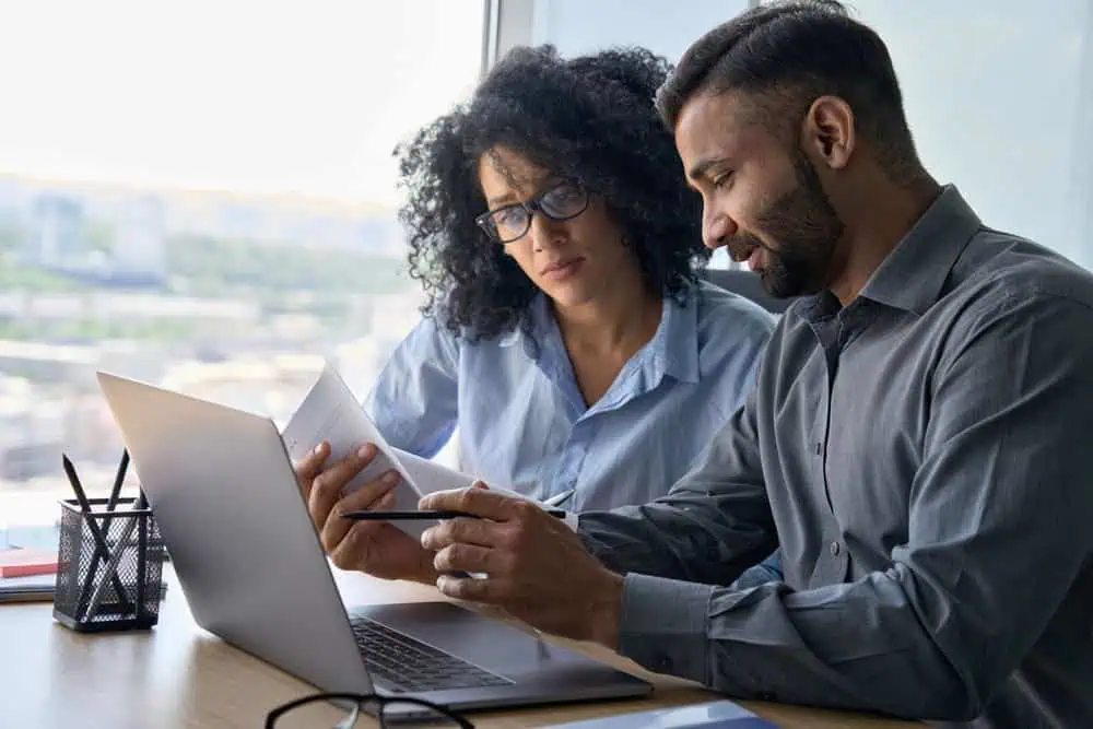 An insurance agent presenting health plus dental plan options to a client