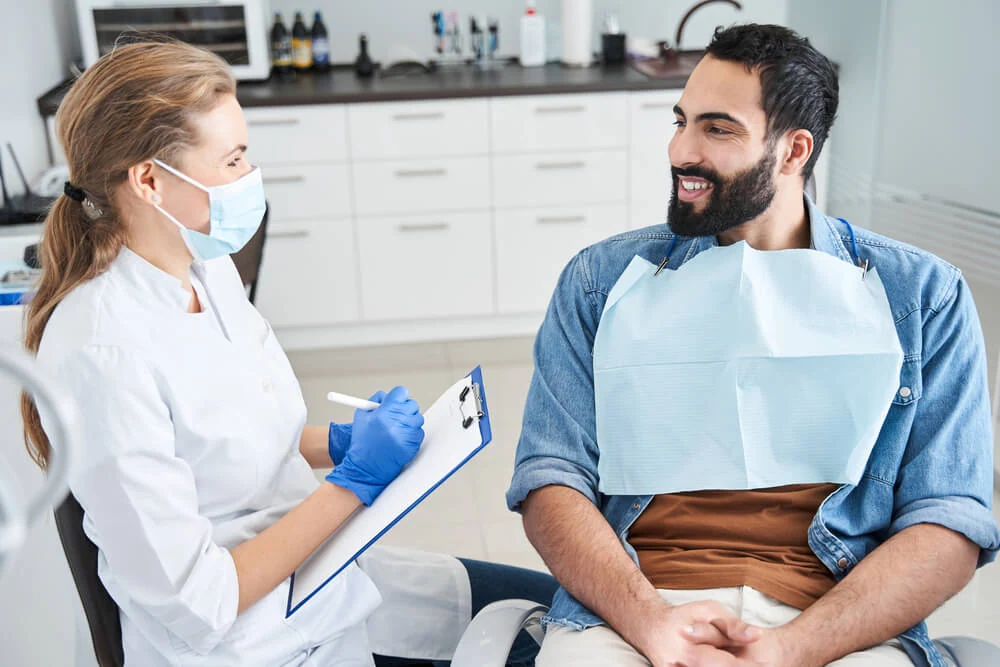dentist-discussing-treatment-cost-with-patient-in-chair-v1 Dental insurance often includes deductibles, annual limits, and higher out-of-pocket costs for dental work.