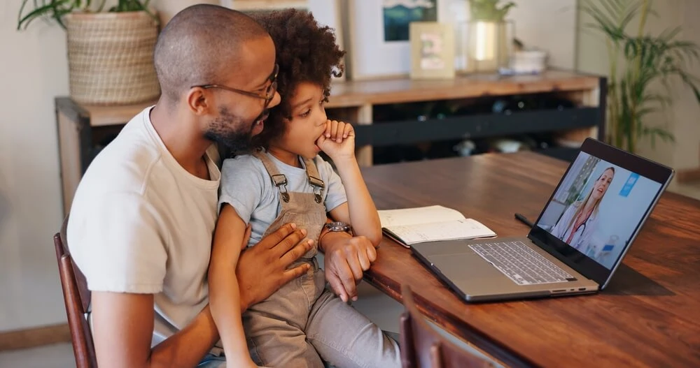 father-and-daughter-on-telehealth-visit Telehealth urgent care provides 24/7 access to sick visits, prescription refills, and medical advice at a lower cost.